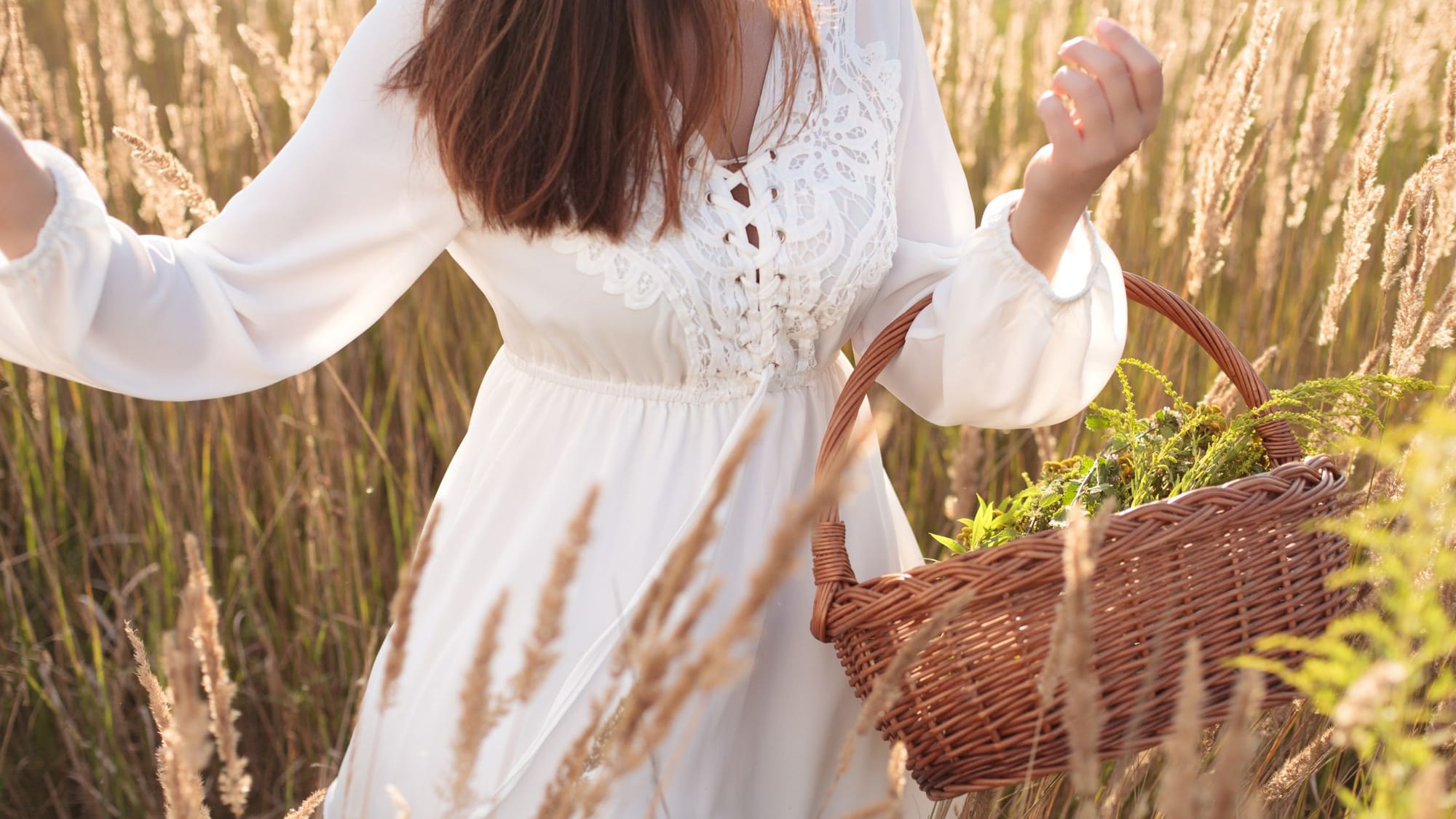 A girl in the field with white dress holding a basket-How To Cast A Circle Of Protection-Sage Sistas