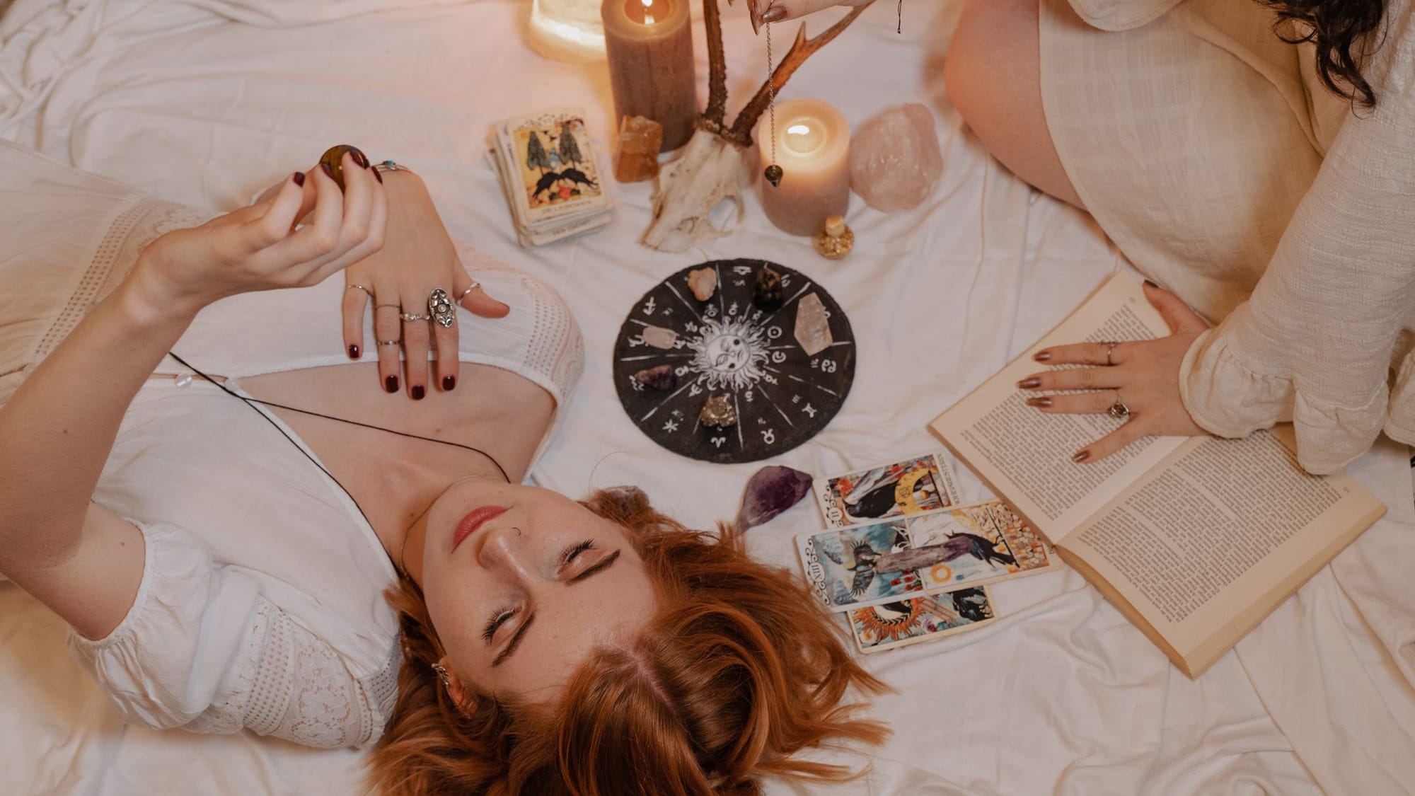 Girls reading tarot with horoscopes - Esoteric Zodiac - Sage Sistas