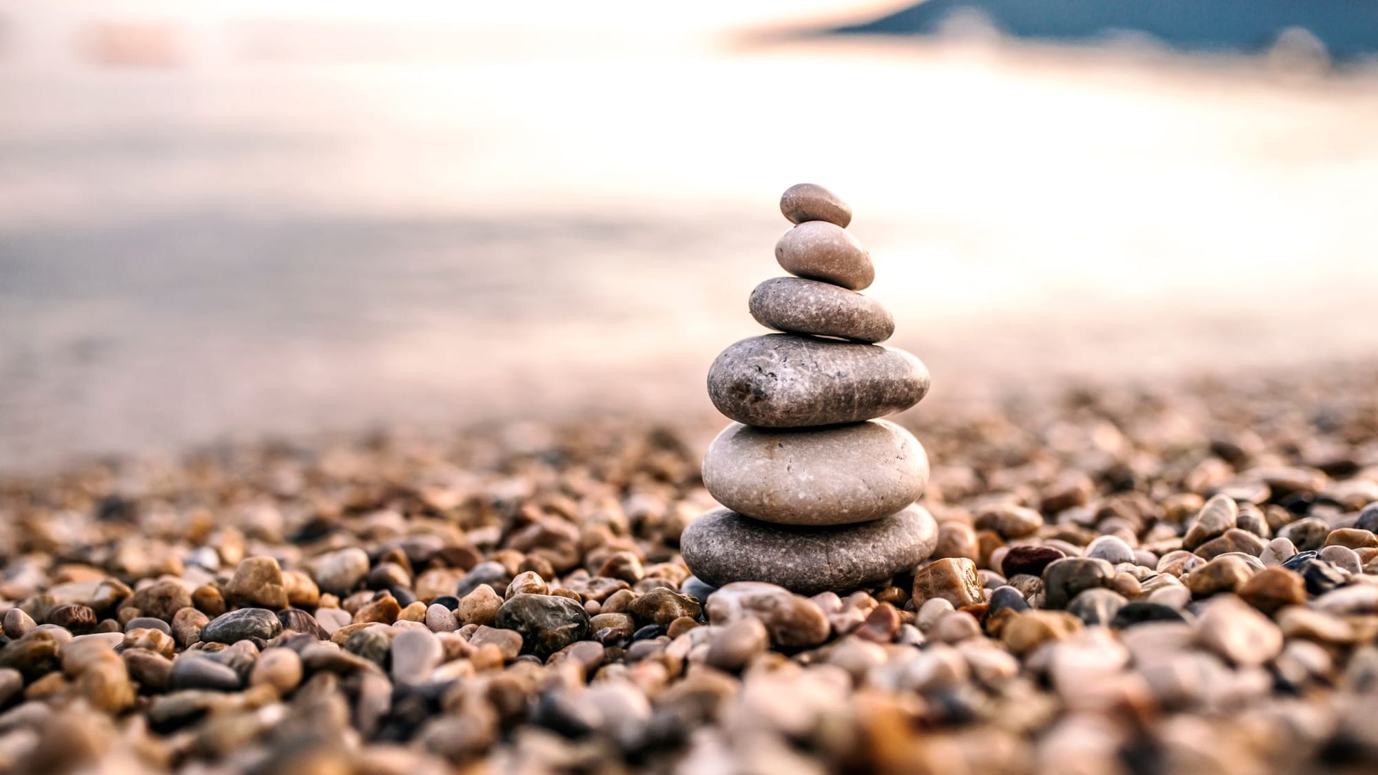 Balanced stones stacked - Somatic Healing - Sage Sistas