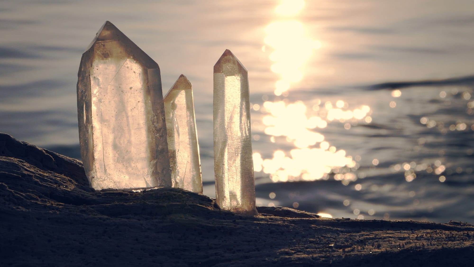 crystals on the beach reflecting sunlight - The witch wound - SageSistas